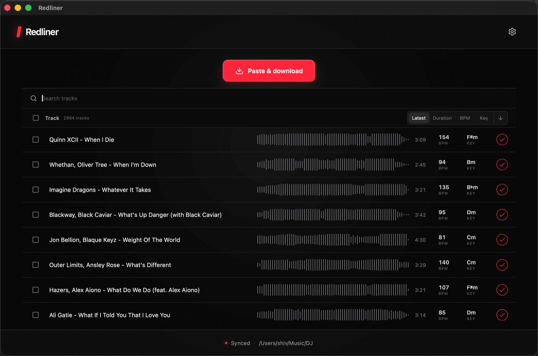 Redliner showing a synced DJ library with waveform, BPM, key, duration, and search